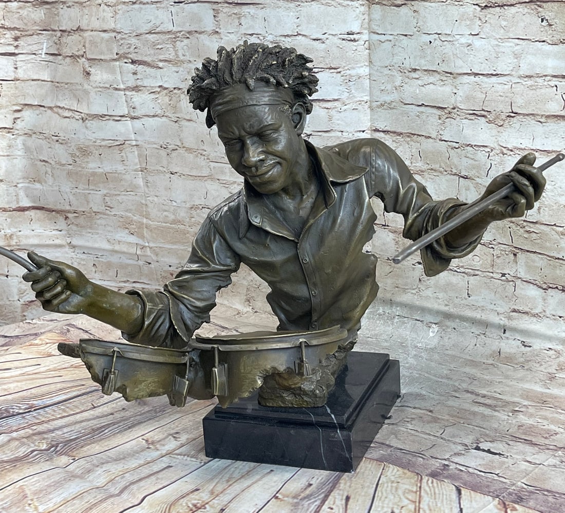Drum Set Figurine Bronze Statue: Bronze Drum Set Figurine Add a special touch to your home decor with this amazing cast bronze drummer figurine. This beautiful work of art is a statue figurine featuring a drummer playing the drums