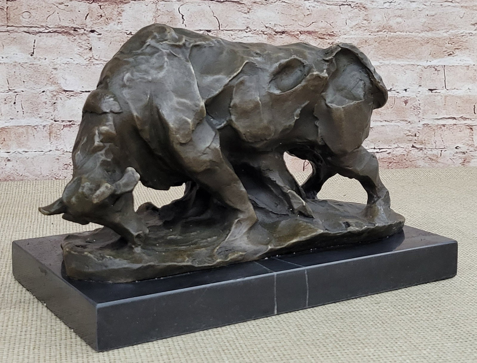Charging Bull Bronze Sculpture: This magnificent modern and abstract Sculpture is of a charging bull. With his head down, his nostrils flared and his muscles tightened he rears up to stomp the ground before him, releasing a vibratin