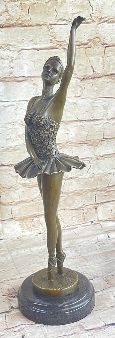 Swan Movie Barbie Ballerina Doll Bronze Statue: The ballerina stands tall and elegant as she looks to the heights of the balcony lovingly waving to the admiring audience in a standing ovation. She wears a tiara and a tutu, the classic costume of th
