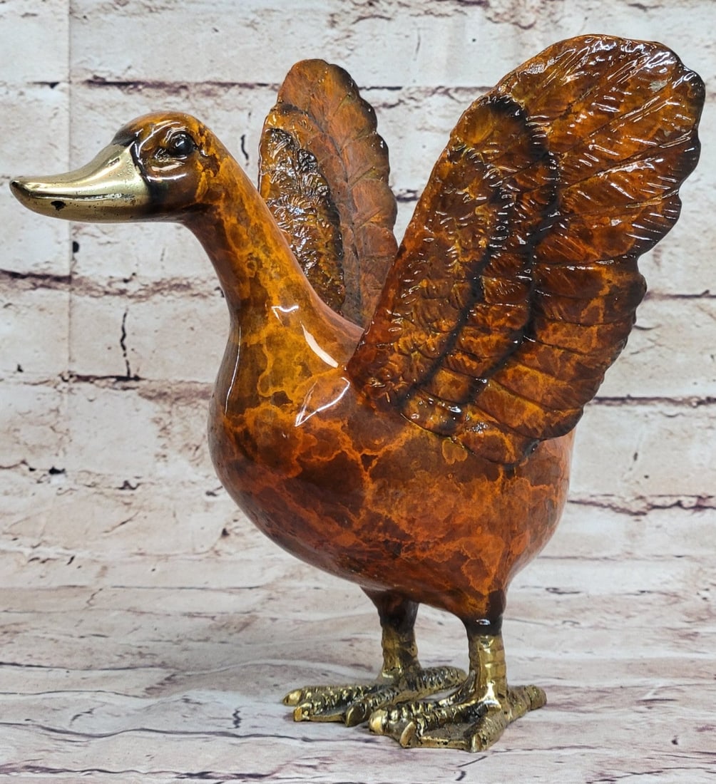 Duck Bronze Figurine: This Bronze Sculpture was produced using the Lost Wax casting method. The Lost Wax Cast method is the most precise metal casting technique in existence, ensuring exquisite detail of the original host 