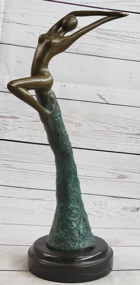 Nude sexy girl Bronze Statue: The illustrative female form rides on the wave of an otherworldly force that pushes her to the icy heights of the heavens. The further she gets, pushed up and away from the material earth, the distinc