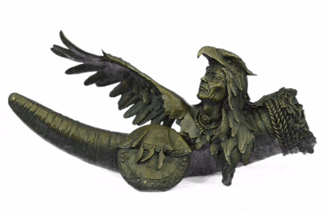 Native American Warrior With Eagle Headdress And Horn Bronze Sculpture: Donning the feathers of the eagle, the most revered bird in Native American culture, this mediator to the spirit world dances a story as old as time. The artist, inspired by traditional Southwest trib