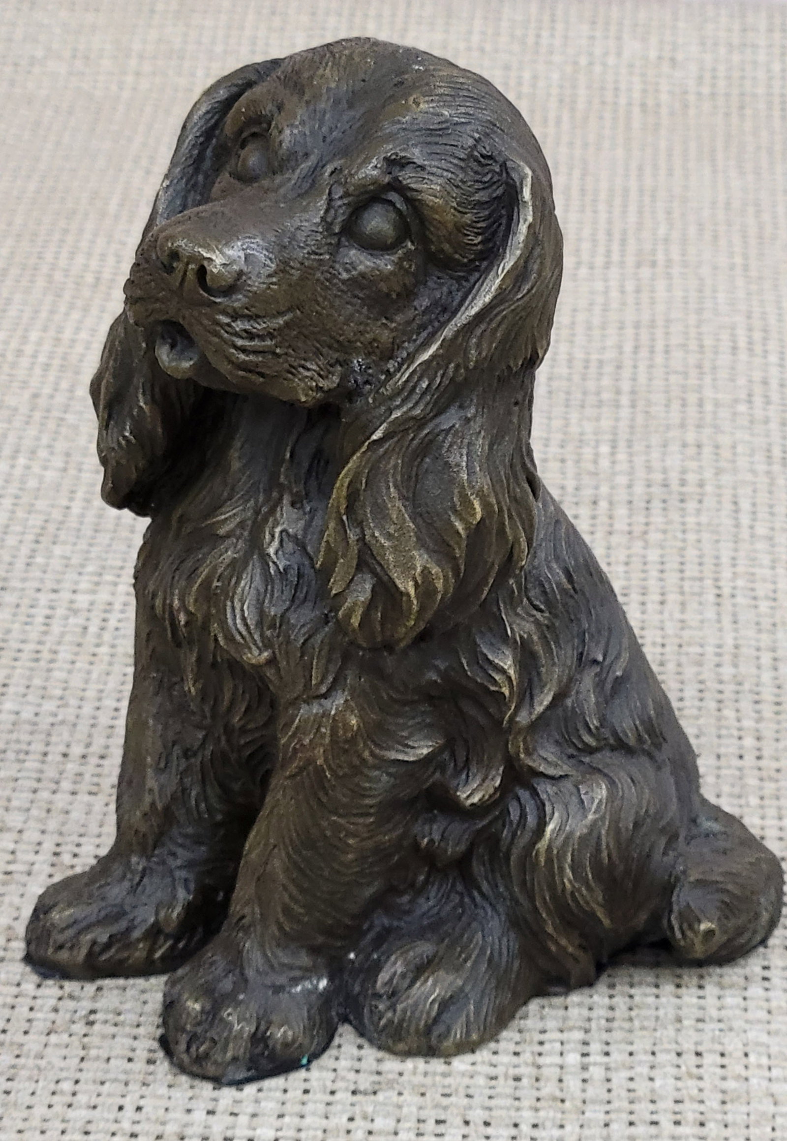 Miniature Cocker Spaniel Dog Bronze Sculpture: This cocker spaniel has amazing details he looks as if he just came back from the lake looking for his master to throw the ball again. He stands attentively and looks steadily at the ball his eyes are