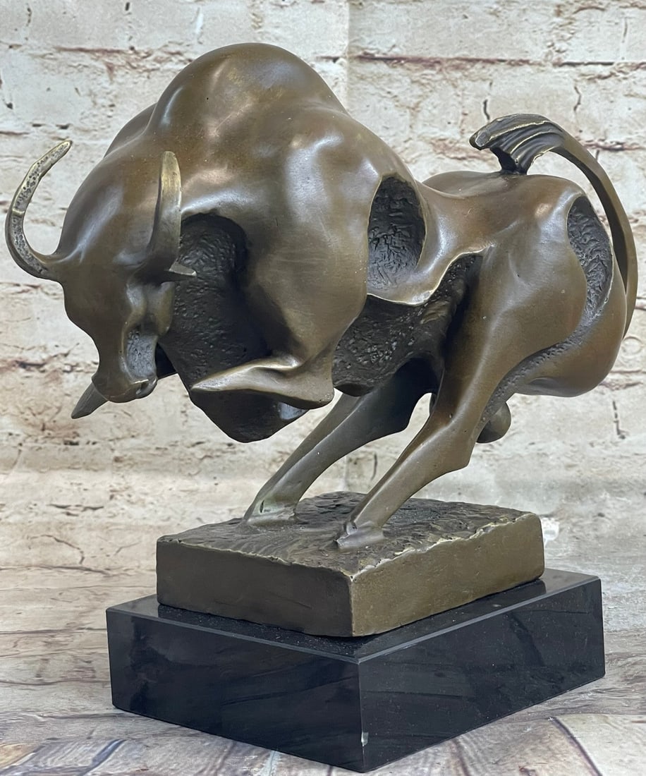 Modern Abstract Charging Bull Bronze Sculpture: This magnificent modern and abstract sculpture is of a charging bull. With his head down, his nostrils flared and his muscles tightened he rears up to stomp the ground before him, releasing a vibratin