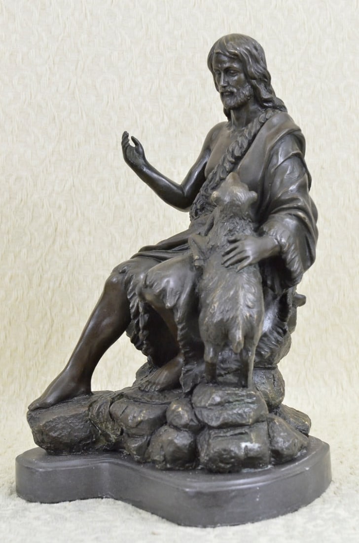 Christian St. Joseph Jesus Lamb Bronze Statue: Jesus Christ sits on a rock raises his hand like an antenna gathering everything in and out of his divine soul. With eyes slightly closed, he seems to take a deep breath inward, gaining his peace, tha
