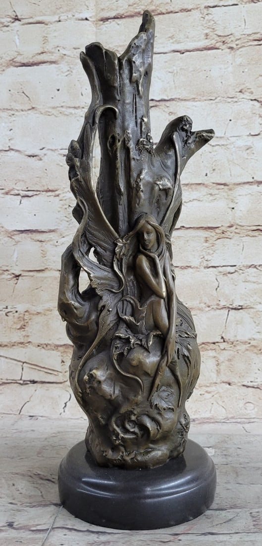 Nude Lady Vase Bronze Statue: The bronze tiny fairy sits, almost integrating herself, into a tree stump in the dusk of evening. With her hand under her chin, she pensively stares at a butterfly fluttering by. A small form of spiri