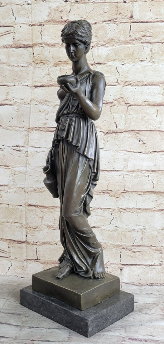 Roman Girl Holding Cup of Wine Bronze Sculpture: The simple young lady holds her water jug and her bowl filled with water prepared to offer to her overseer who has called upon her for a beverage. Her hair is styled in a simple braided updo. Her loos