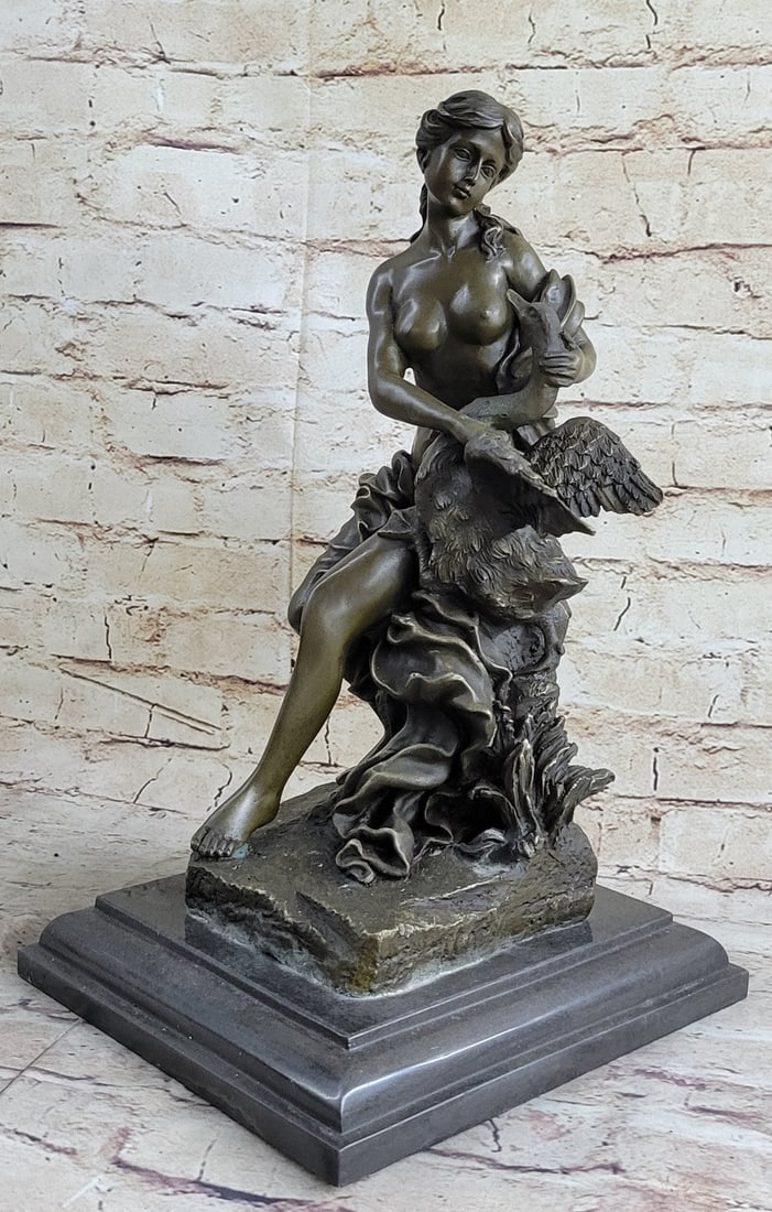 Leda and the Swan Greek Mythology Bronze Sculpture: Leda and the Swan is a story in Greek mythology. The story remains that the god Zeus seduced Leda in the form of a swan. Leda is the mother of Helen. In this sculpture, Leda sits semi-nude holding on 