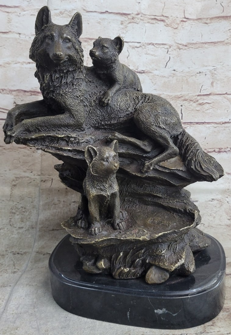 Wolf Animal Edition Bronze Statue: The wolf mother and cubs can be imagined to be seen, masked by the falling snowflakes, sitting among the rocks of the entrance of their den. The mother lays exhibiting her patience as one of her
