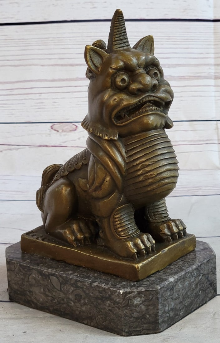Foo Dog Bronze Sculpture: This is a bronze sculpture of a Foo Dog which is a Chinese guardian lion, known also as Imperial guardian lions. They are believed to have powerful mystic protective powers and traditionally stood in 