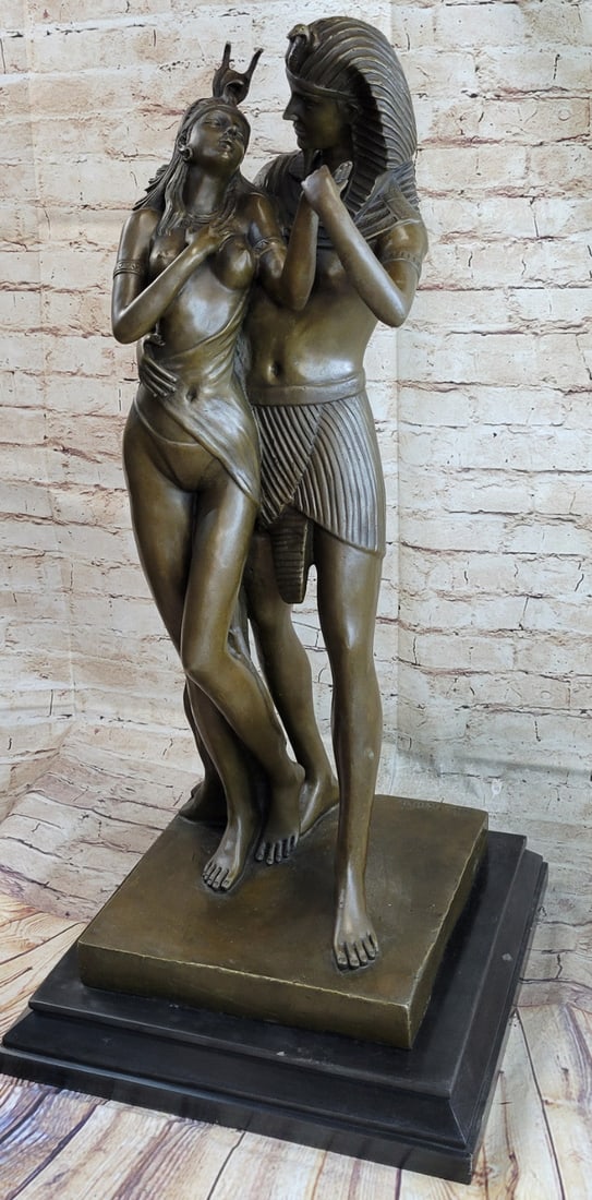 Akhenaten and Nefertiti Royal Bronze Sculpture: This is a bronze sculpture of the ancient King and Queen, Akhenaten and Nefertiti, a brother and sister royal pair known for their religious revolution in Egypt, in which they started to worship one