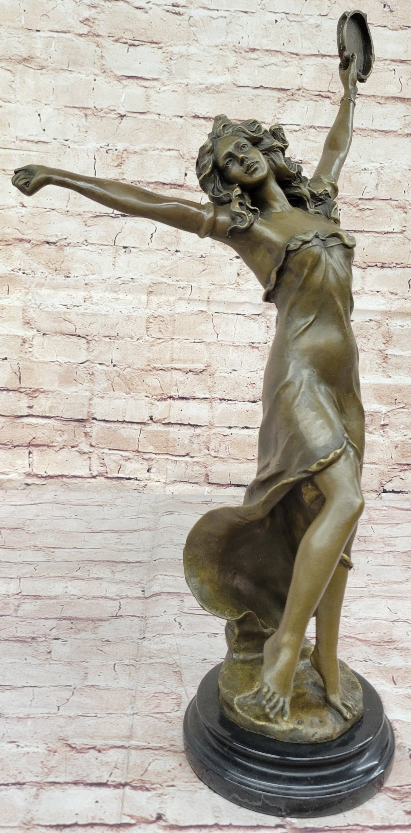 Dancer Bronze Statue: It is difficult to say whether the fine sculpture or the sheer presence of this beautiful art nouveau dancer first entrances the eye! Pure fluidity, the lithe figure, and flowing tresses of the mademo