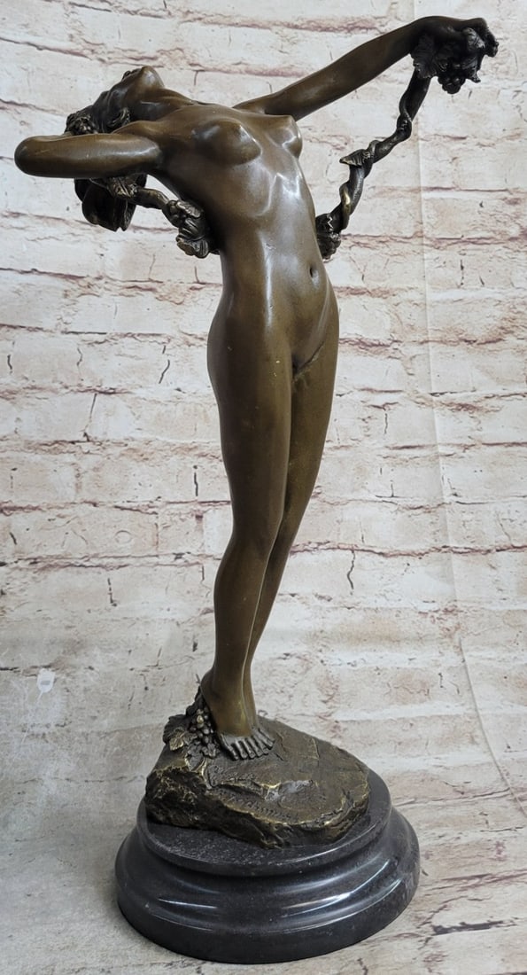 Nude Beauty Stretching Bronze Statue: The nude beauty leans far back from the rush of ecstasy that surges from her head to her toes. Amidst the airs of the nature, she holds her roped hair in her left hand offering it to gravity. Her hair