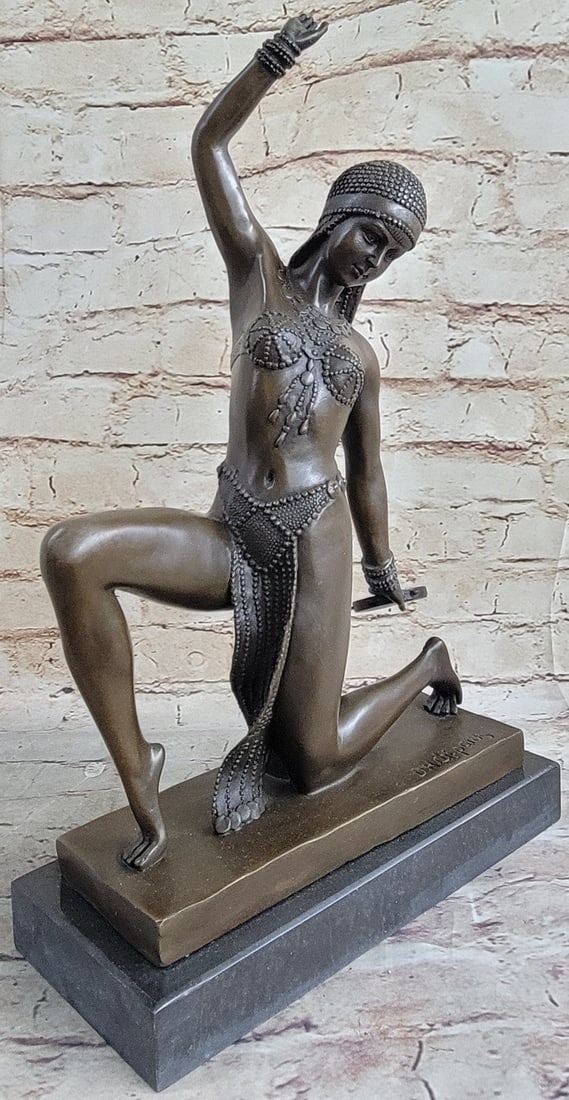 Dancer Bronze Statue: A very stylish beautiful reproduction figure after D.H. Chiparus, originally created during the Art Deco Period. Dark patina face, hands, and body elements and Marble base. Dimensions: Height 16 X Wid