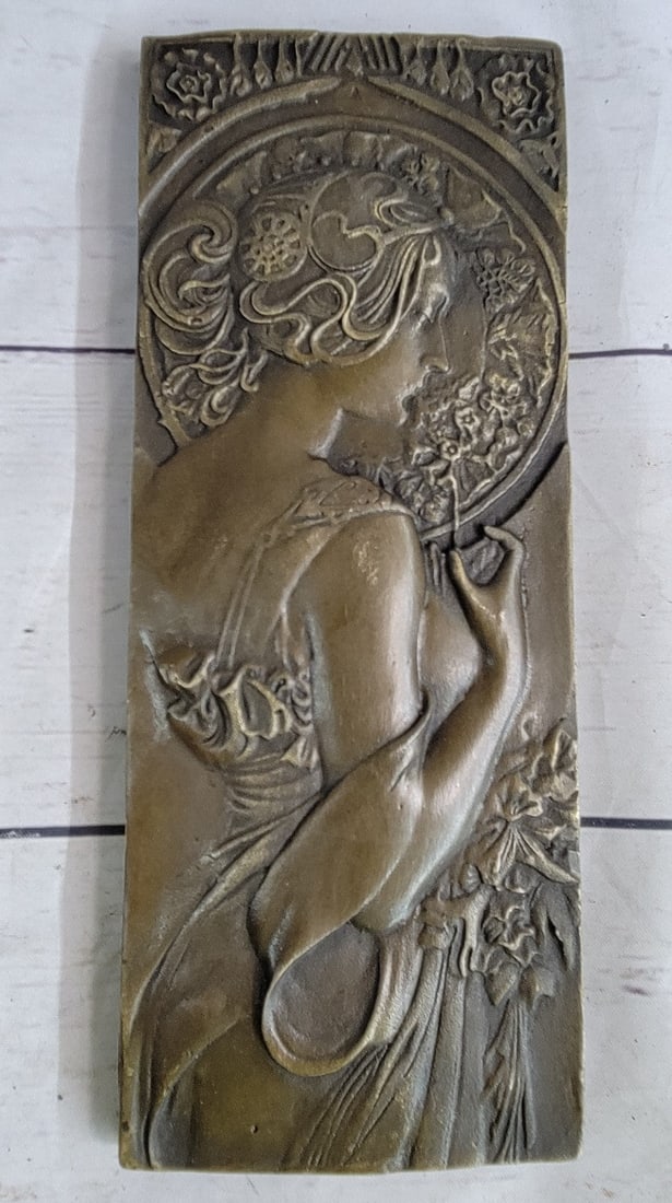 Bas Relief Bronze Sculpture: These Breathtakingly beautiful these bas reliefs show a side profile of a woman both amazingly delicately prepared with detail. Both rectangular pieces are framed and bordered with flowers. This