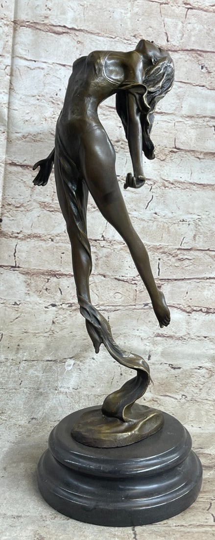 Scarf Dancer Bronze Figurine: The nude aerialist is seen leaping into the air as a fabric banner, coated in a vibrant green patina, twines itself around her sculpted body. This work of art rejoices the female figure and shows