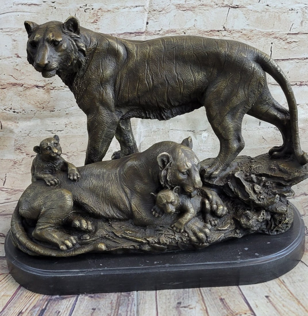 Wolf Life Animal Edition Bronze Sculpture: This beautiful family of Lions looks adorable, the mother is at the piece while the father stands and paces back and forth on the lookout. The mother licks one of her little cubs while the other one r