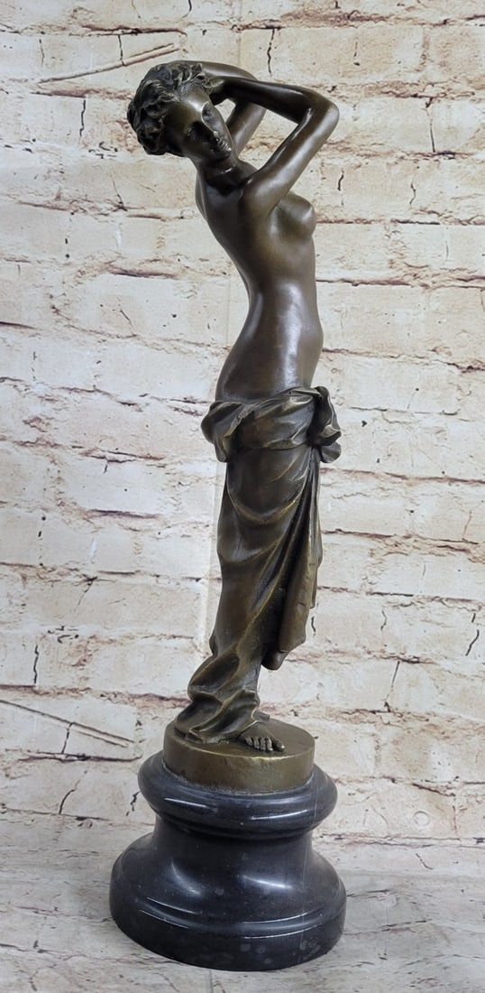 Female Bronze Sculpture: The slender provocative woman is captured in a sensual dance. Her body can be seen swaying and twists side to side as she has removed each article of clothing except for her undergarment and high heel