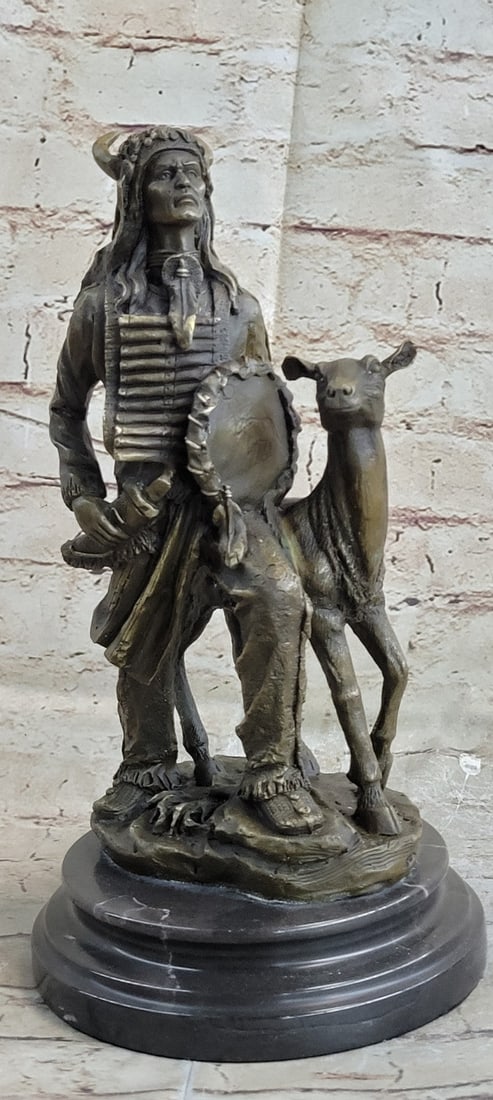 Native American Warrior with Deer Bronze Sculpture: The Native American warrior can be imagined walking through a wind-whipped forest, strolling with a deer in, looking high into the sky that appears and disappears through the dancing leaves of treetop