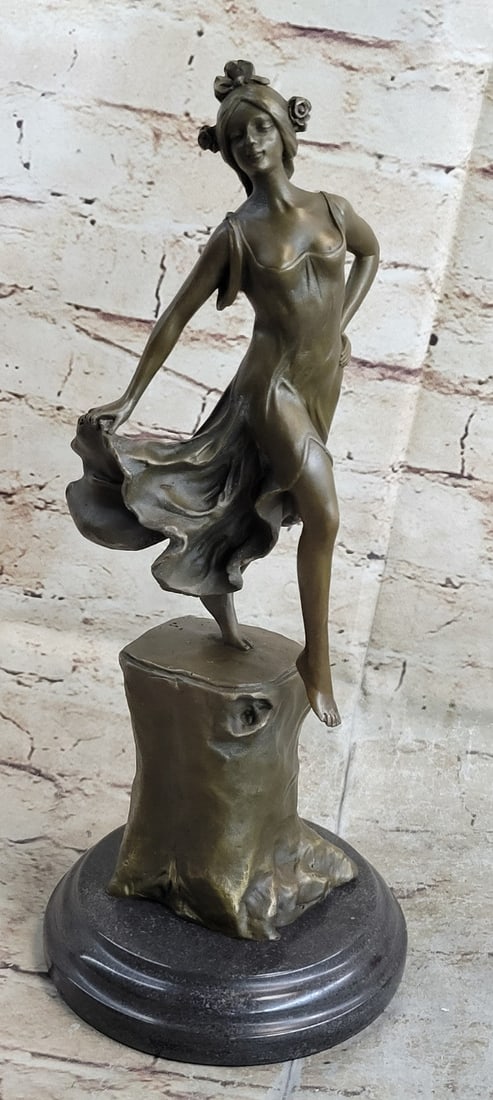 Dancer Bronze Sculpture: Graceful fairly like figurine, with aloof expression and art Nouveau hairstyle, and is a solid cast. This bronze sculpture on a marble base has a two-tone brown patina and is cast using the ancient