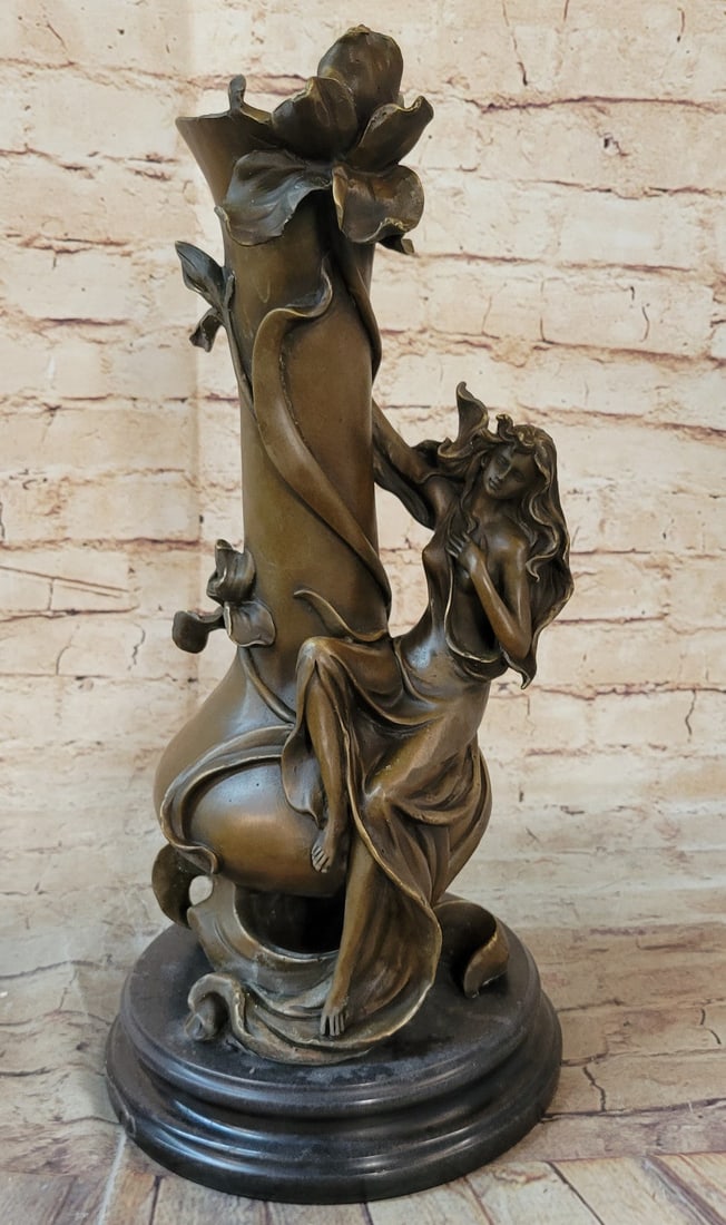 Sexy Goddess Vase Bronze Sculpture: Sensual nude women lean against a stone with every curve defined in vivid detail. Her slender long arms are extended, as she stares seductively downwards. Her legs seem to stretch for miles as one get