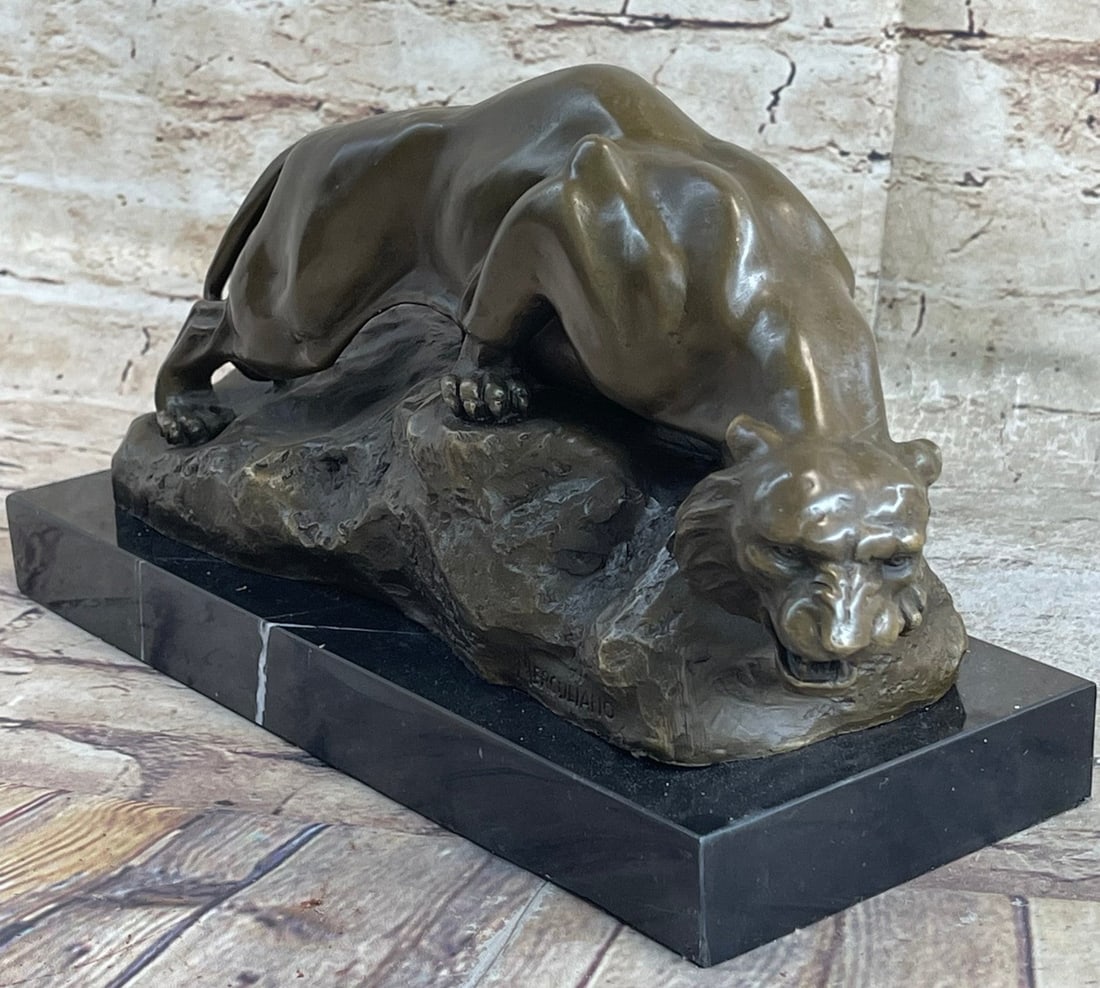 Mountain Lion Bronze Sculpture: Capturing both the raw vitality and the sculpted form of one of nature's most magnificent creatures, the artist has rendered the spirit of a leopard relishing its coveted freedom. Its fluidity of