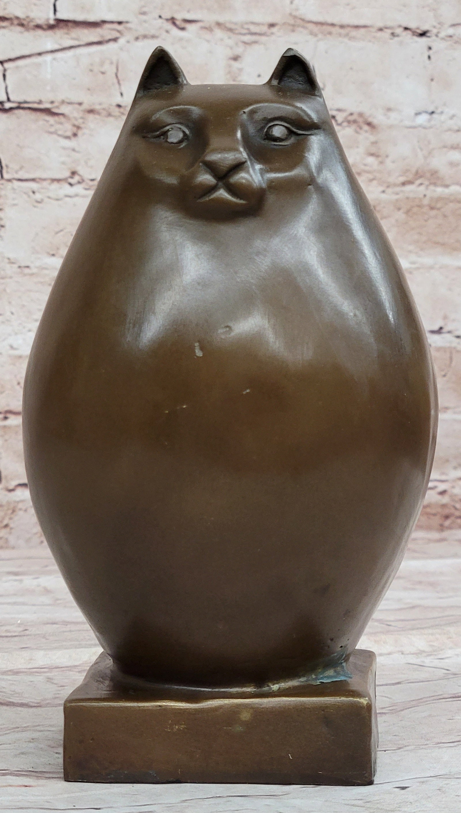 Modern Art Bronze Sculpture: This cat is a bronze figure Fat Cat. This bronze sculpture was cast using the lost wax method. Dimensions: Height 8 X Width 4 inches. Weight: 5 LBS.