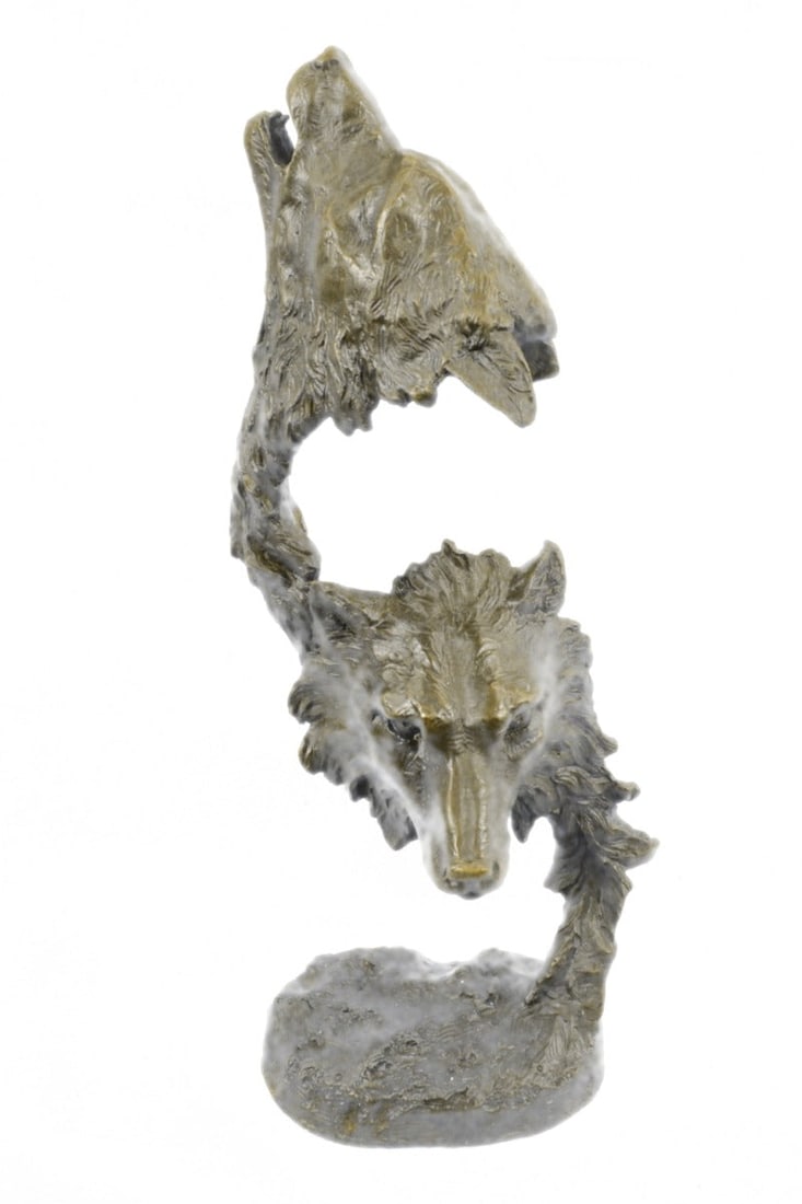 Two Wolves Head Wildlife Bust Bronze Sculpture: Wolves are social predators that live in nuclear families consisting of a mated pair, offspring, and occasionally adopted subordinates. They are a loyal bunch, protecting and providing for one