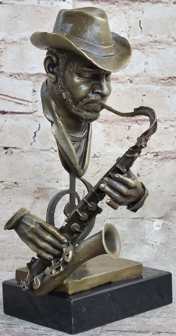Saxophone Player Bronze Sculpture: This Bronze Bust of a Musician Playing the saxophone figurine. The craftsmanship of this lovely Saxophone Player Figurine is truly remarkable and this masterwork fills any room with pure joy of