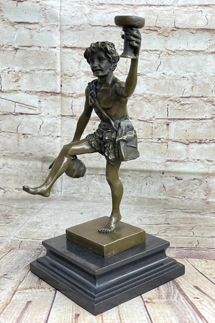 Greek God of Wine Bronze Sculpture: The Greek god of wine and plenty, Dionysus is often viewed as a deity of hedonism and ecstasy, he was also quite popular among the Romans, who knew him as Bacchus. He was also the patron deity of