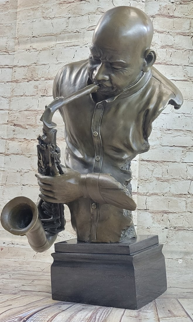 Saxophonist Saxophone Player Bronze Sculpture: This bronze statue will bring an added touch to any room in your home or office. Cast bronze sculpture features the forms of a saxophone player and saxophone. This bronze sculpture was cast using the