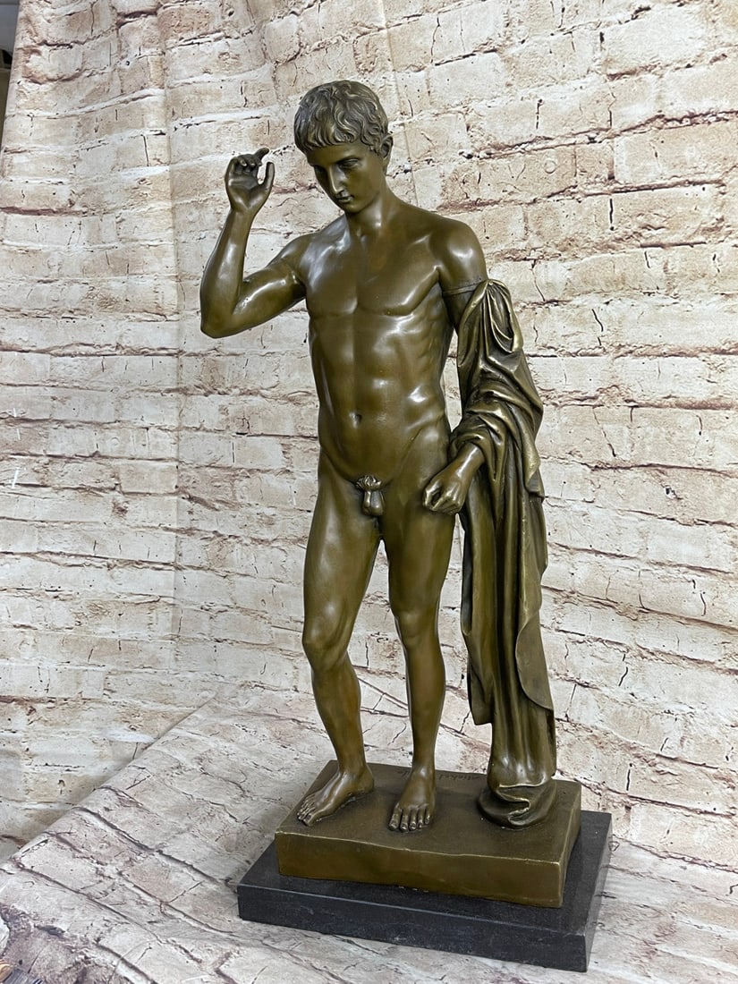 Nude Muscular Man Bronze Sculpture: A nude statue of David stands tall. His body is carefully crafted in a brown patina, exposing his muscular frame. His stomach is especially well-defined. His abdomen is cut and his hips curve