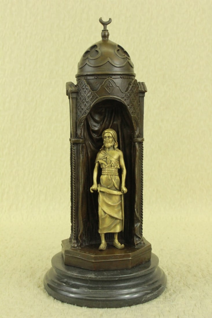 Arab Man Protecting Bronze Sculpture: This beautiful and very well-done bronze reproduction measures 14 inches high?sitting on a marble base.?Features a Guard protection for a slave young lady in the harem.?Dimensions: Height 14 X Width