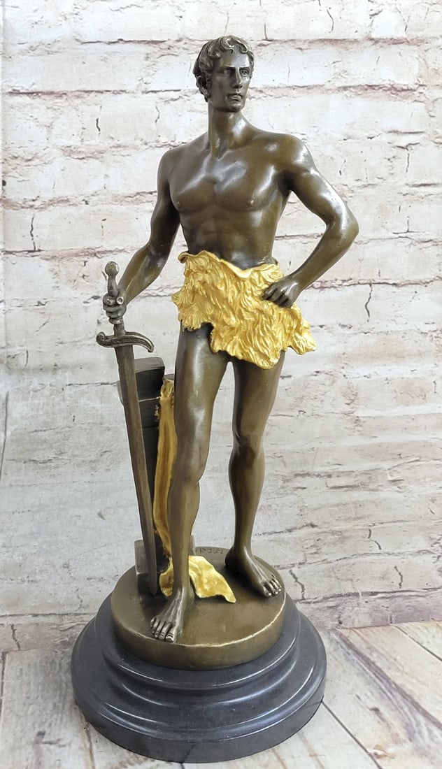 Warrior Bronze Sculpture: Marice Constant bronze "Boucheron" sculptur. Boucheron bronze sculpture of a semi-nude man holding a sword. This bronze sculpture was cast using the archaic method of lost-wax casting and stained