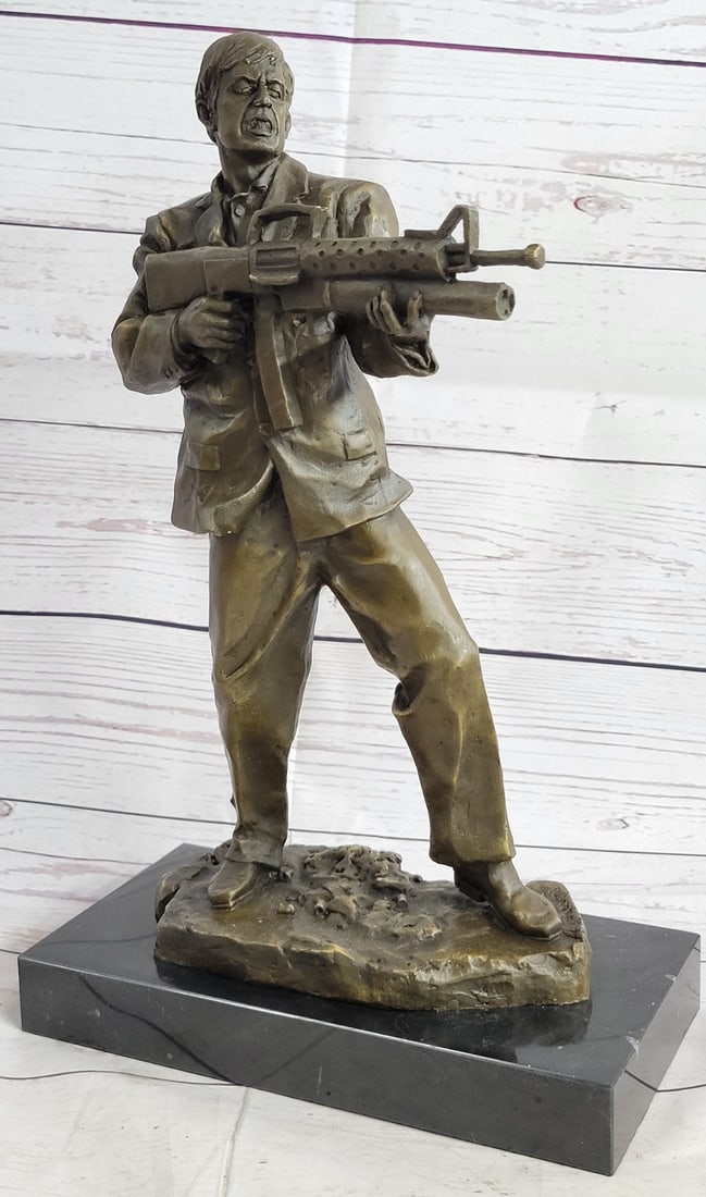 Scarface Tony Montana Bronze Sculpture: This bronze sculpture Scarface Montana from the eponymous De Palma film in the middle of his infamous last stand against a team of would-be Cuban assassins.?The classic line Jou Waneh a piece me is