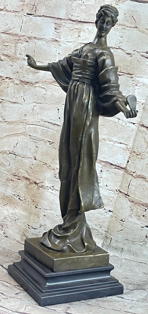 Girl With Mirror Bronze Sculpture: The self-admiring beauty is casually standing as her arms are extended to her sides.?She wears this gorgeous long and loose dress that hangs to her feet. The sculpture reminisces the ancient Classical