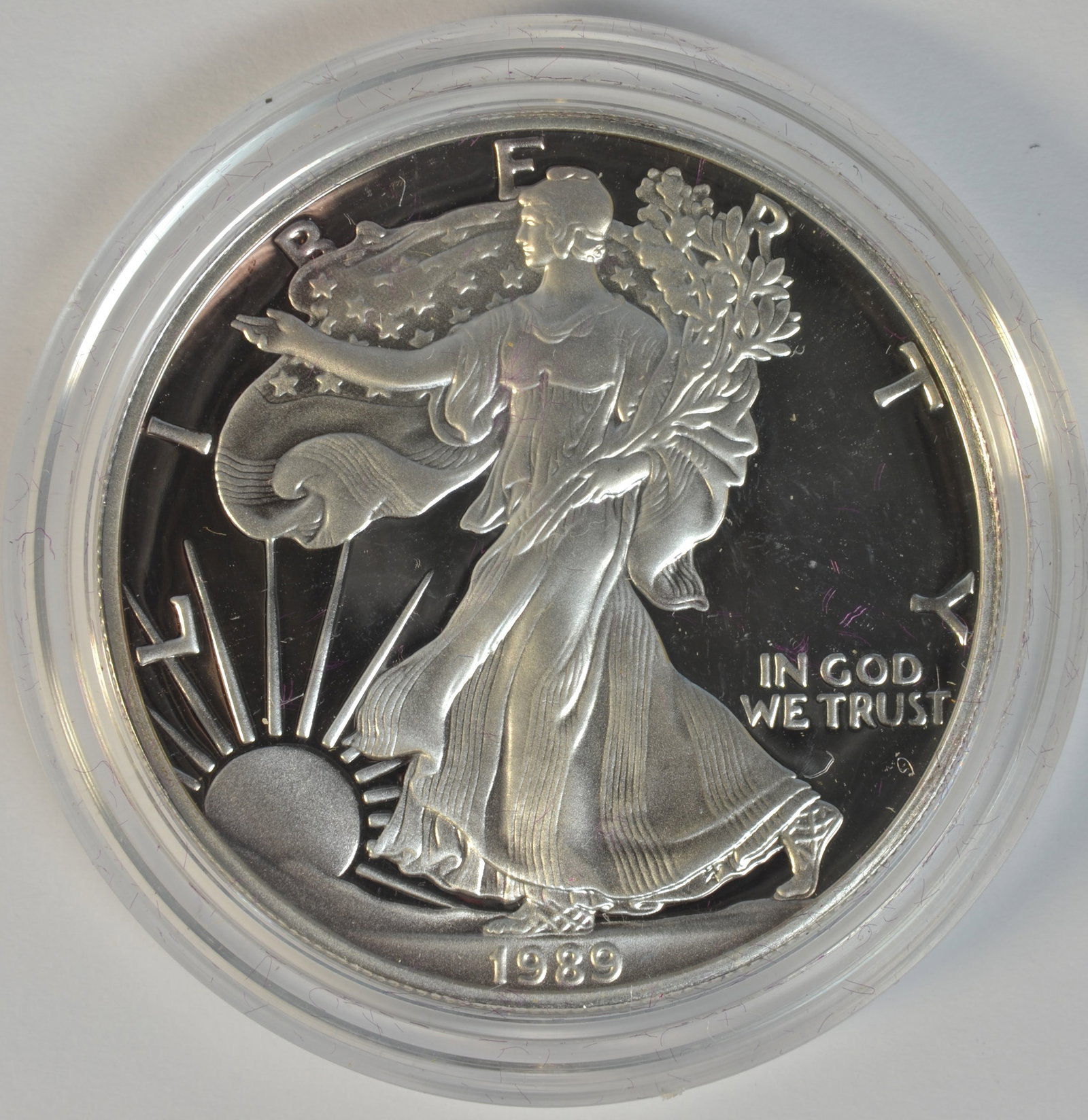 1989-S 1 oz Proof American Silver Eagle with Original Box & COA ? U.S. Coin: This 1989-S American Silver Eagle Proof coin is a stunning addition to any collection. Struck in .999 fine silver at the San Francisco Mint, this coin comes in pristine proof condition with its origin