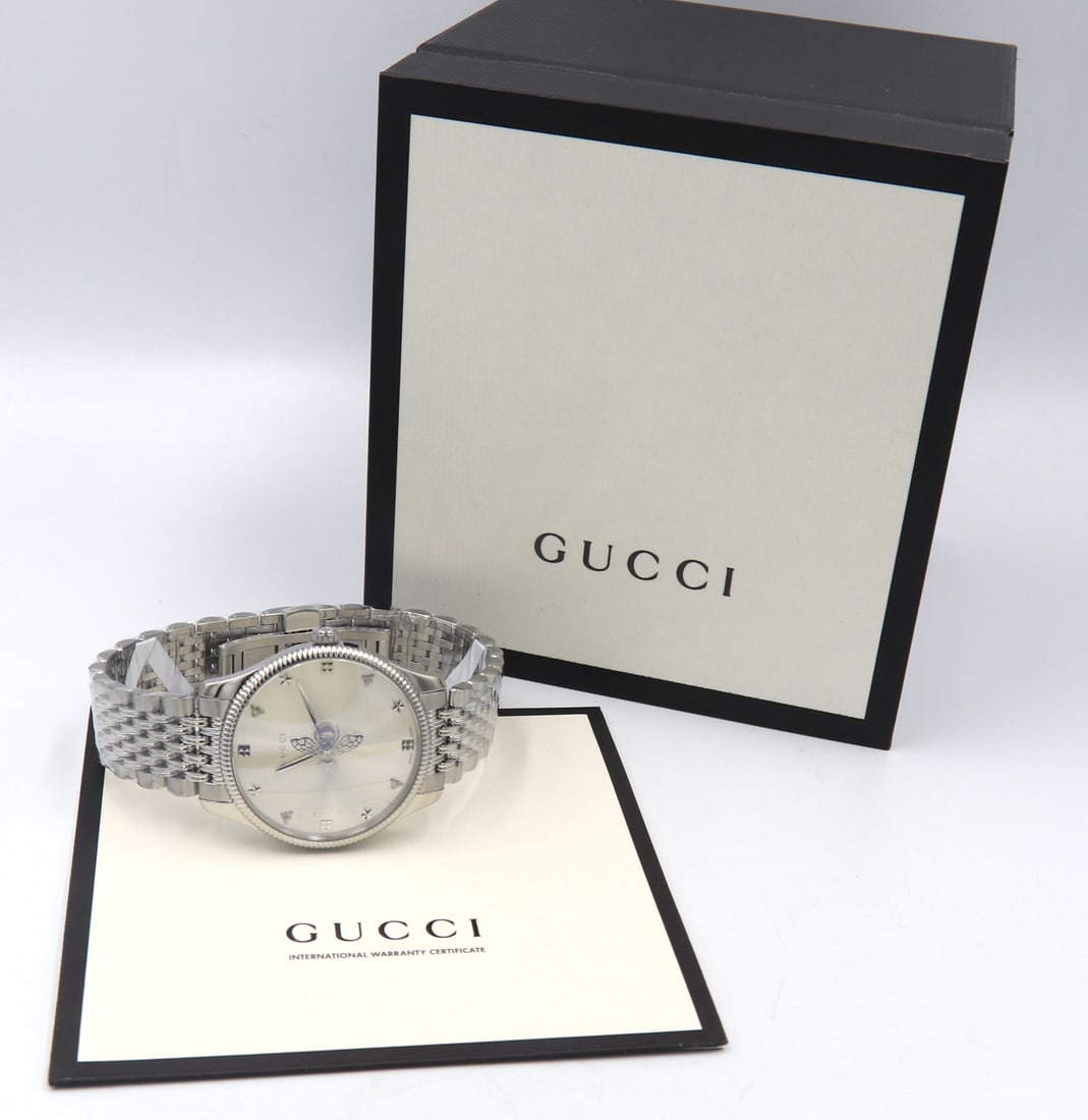 Gucci Watch | 36mm G-Timeless Bee Bracelet: Brand new Gucci 36mm G-Timeless Bee Sunray silvertone dial, scratch-resistant sapphire crystal, nine-link bracelet with folding closure, two-hand quartz Switzerland movement.
