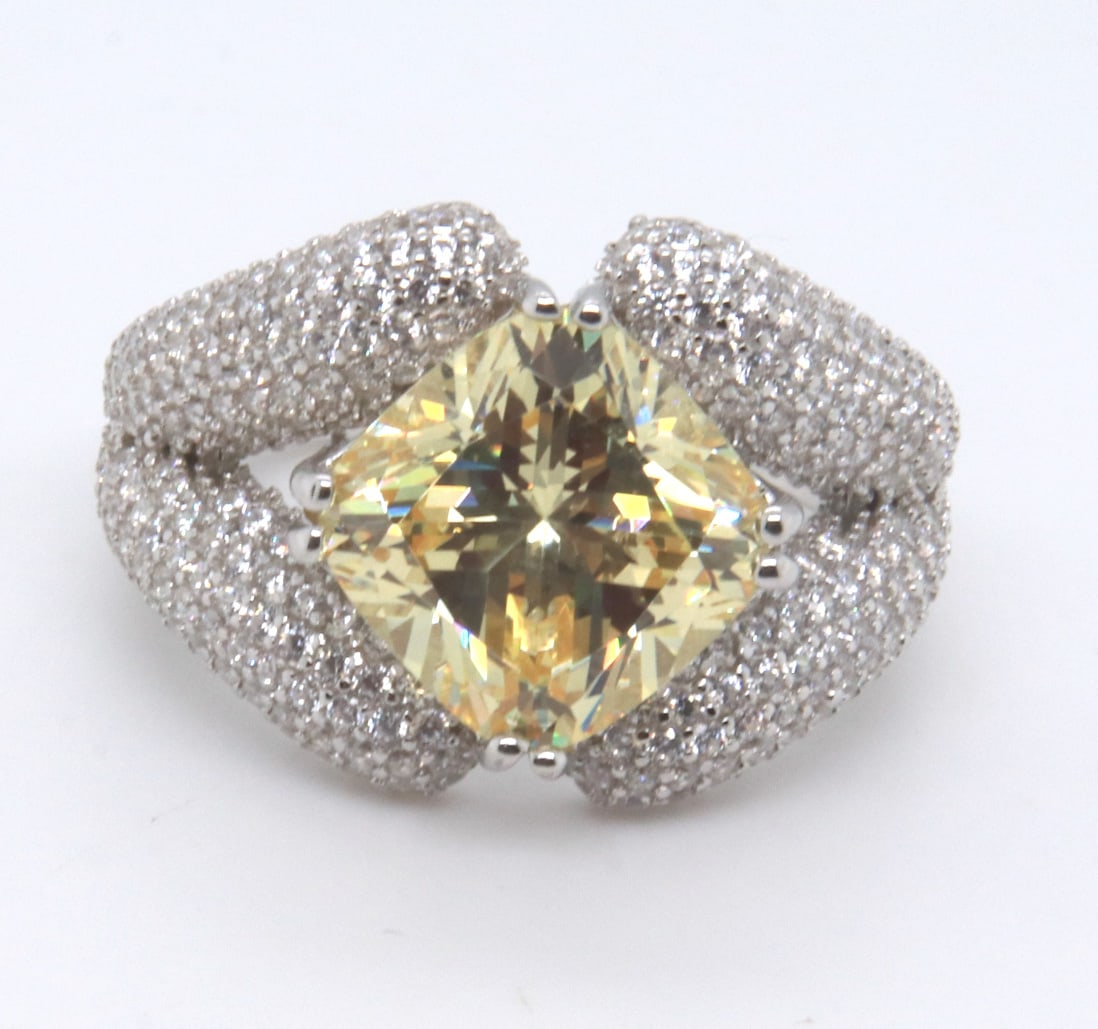 Sterling Silver Yellow Cubic Zirconia Ring: 925 Sterling Silver Yellow Cubic Zirconia Ring. Total weight of Ring 9.36 Grams. Ring Size 7"
