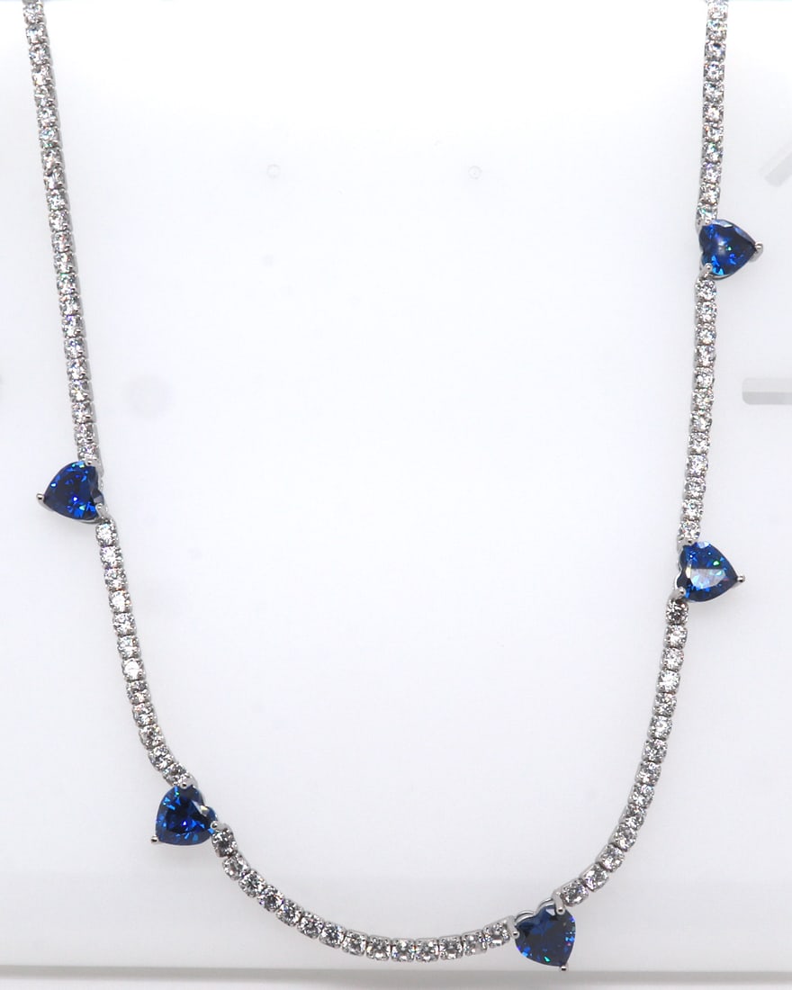 Sterling Silver Blue Heart Shaped Cubic Zirconia w White Cubic Zirconia Necklace: 925 Sterling Silver Blue Heart Shaped Cubic Zirconia with White Cubic Zirconia 14-18 inches Necklace. Total weight of Necklace 14.15 Grams.