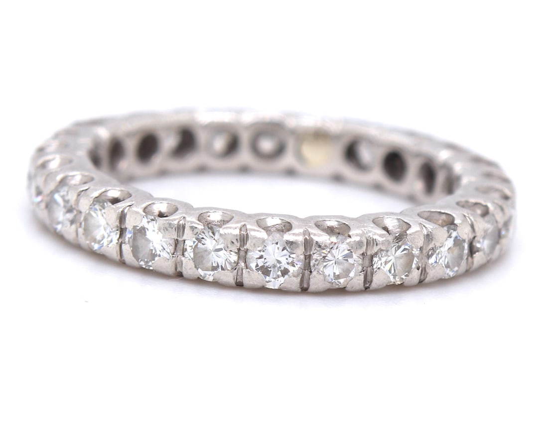Platinum 1ctw round brilliant cut diamond eternity band: Platinum eternity band. Containing twenty four round brilliant cut diamonds approximate 1cts. Clarity VS-1 to VS-2. Color G-H. Total weight of band 4.67 grams. Comes with LGL. Ring size 5.25"
