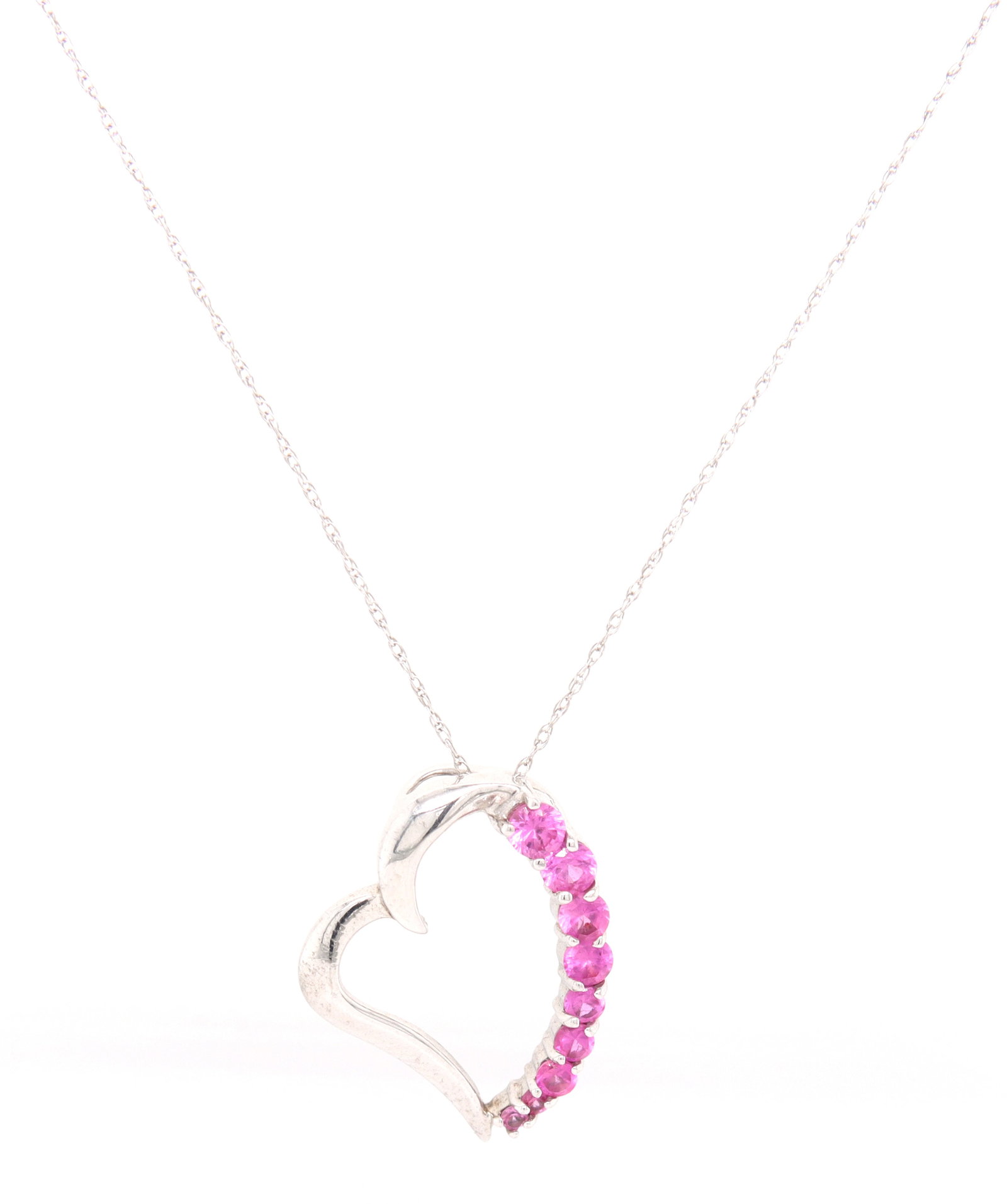 10kt White gold pink topaz heart shaped pendant on chain: 10kt White gold pink topaz heart shaped pendant on 17-inch chain necklace. Total weight of necklace is 2.3 grams.