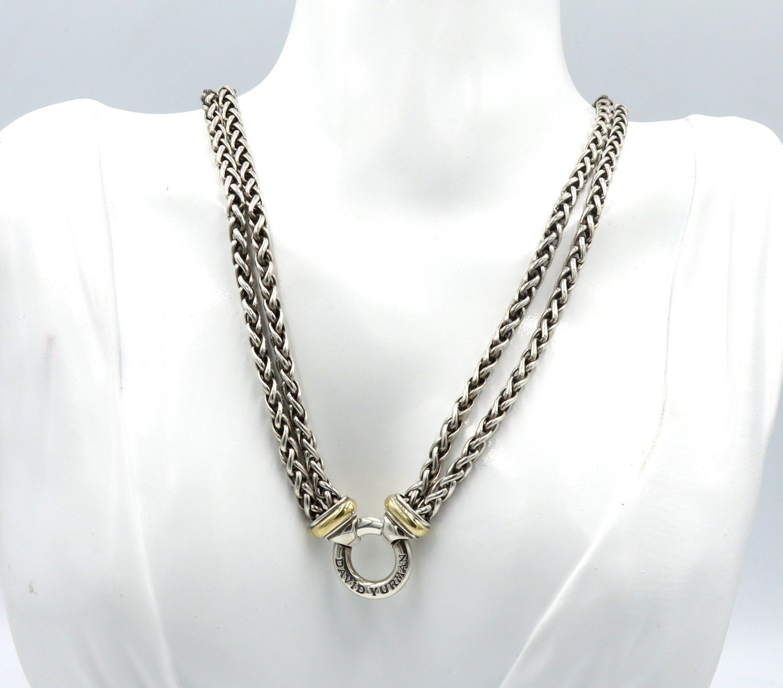 David Yurman double wheat chain necklace with circle pendant: David Yurman double wheat 16-inch chain donut necklace in 925 sterling silver and gold accent. Total weight of the necklace is 53.40 grams.
