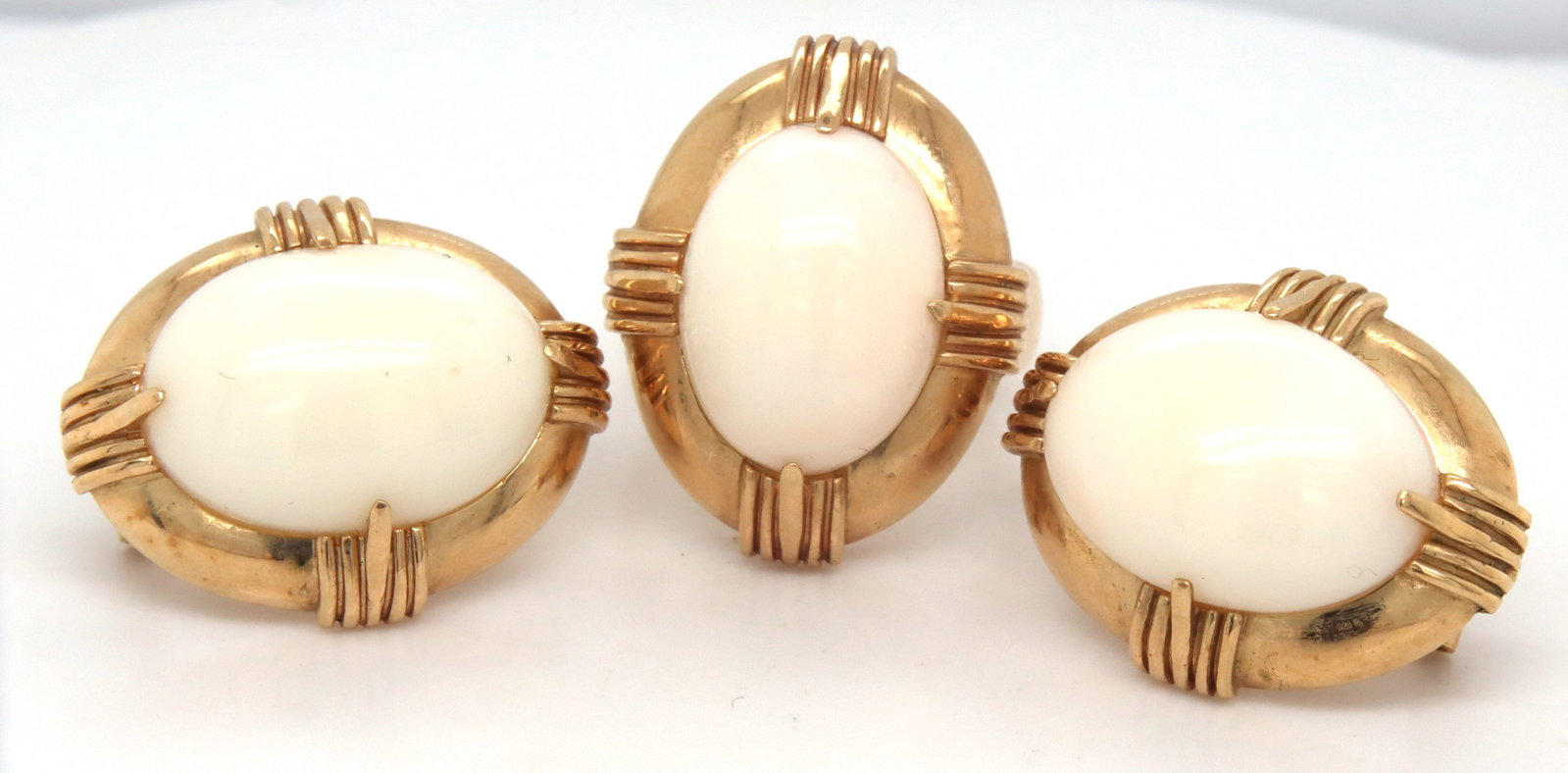 Set of 14kt yellow gold white agate ring and matching earrings: Set of 14kt yellow gold white agate ring and matching earrings. The total weight of the lot is 24.6 grams. Ring size 8".