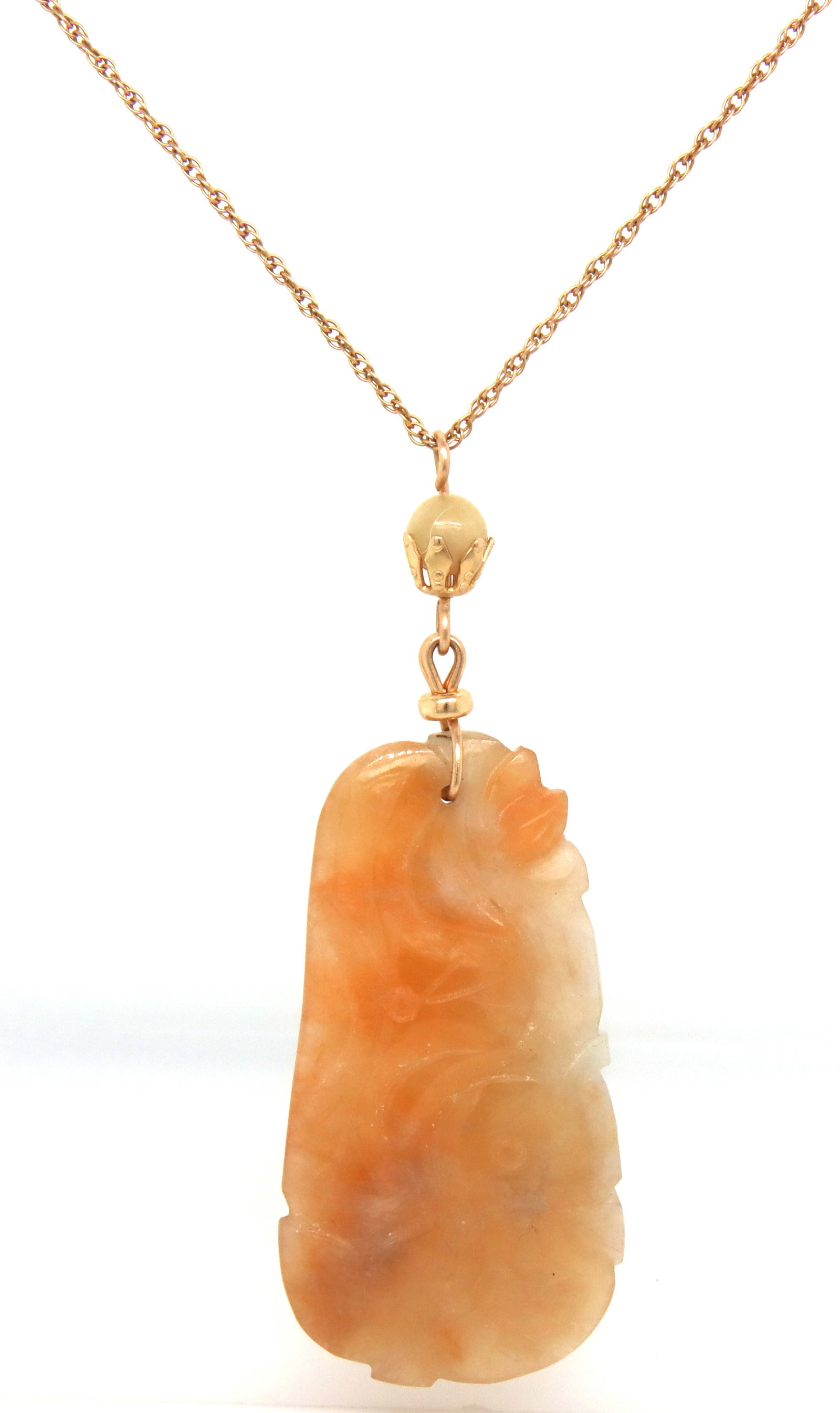 14kt Yellow gold Jade pendant on chain: 14kt Yellow gold Jade pendant on 18-inch chain necklace. The total weight of the necklace is 10.5 grams.