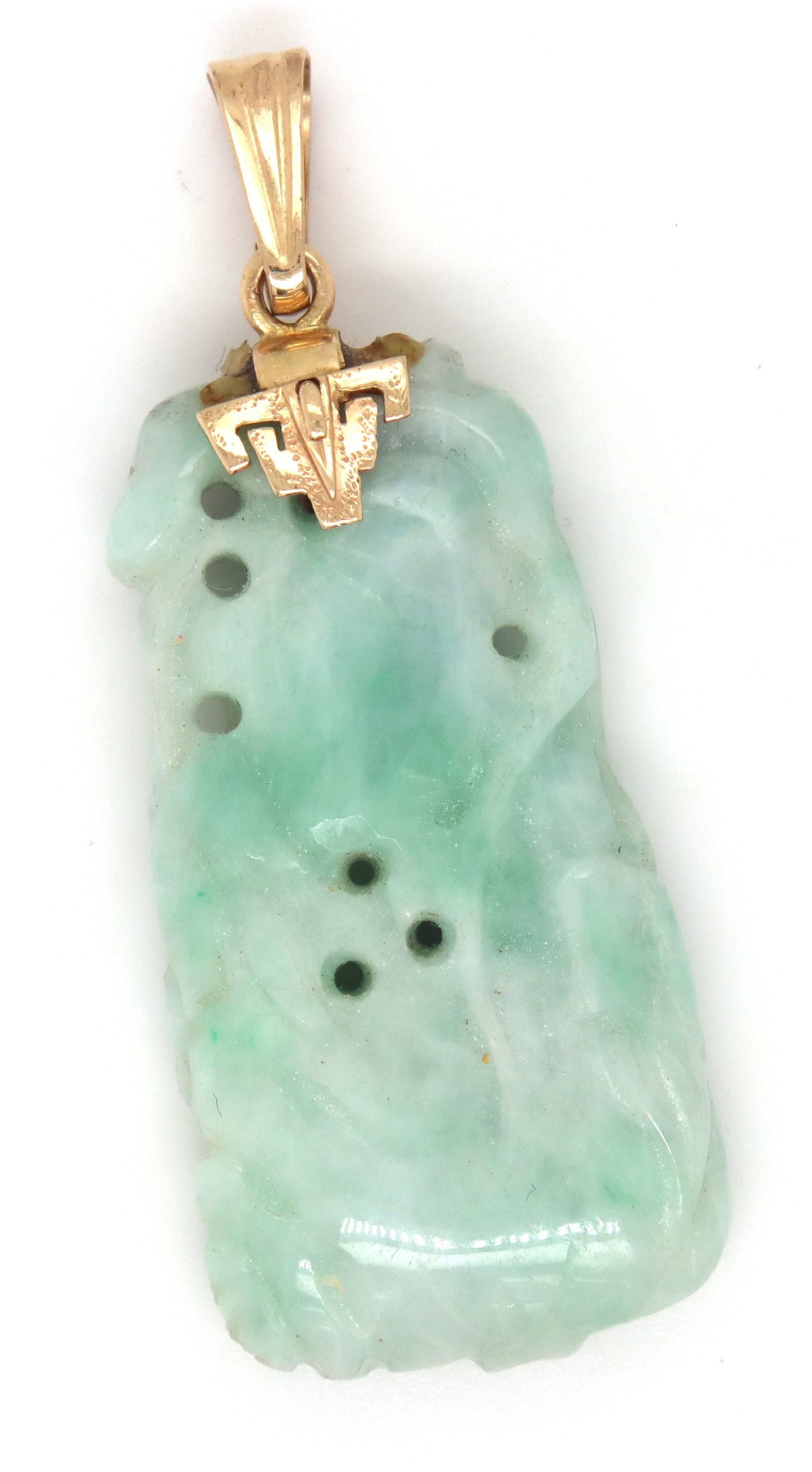 Hand carved green Jade pendant in 14kt yellow gold: Hand carved green Jade pendant in 14kt yellow gold. The total weight of the pendant is 15.1 grams.