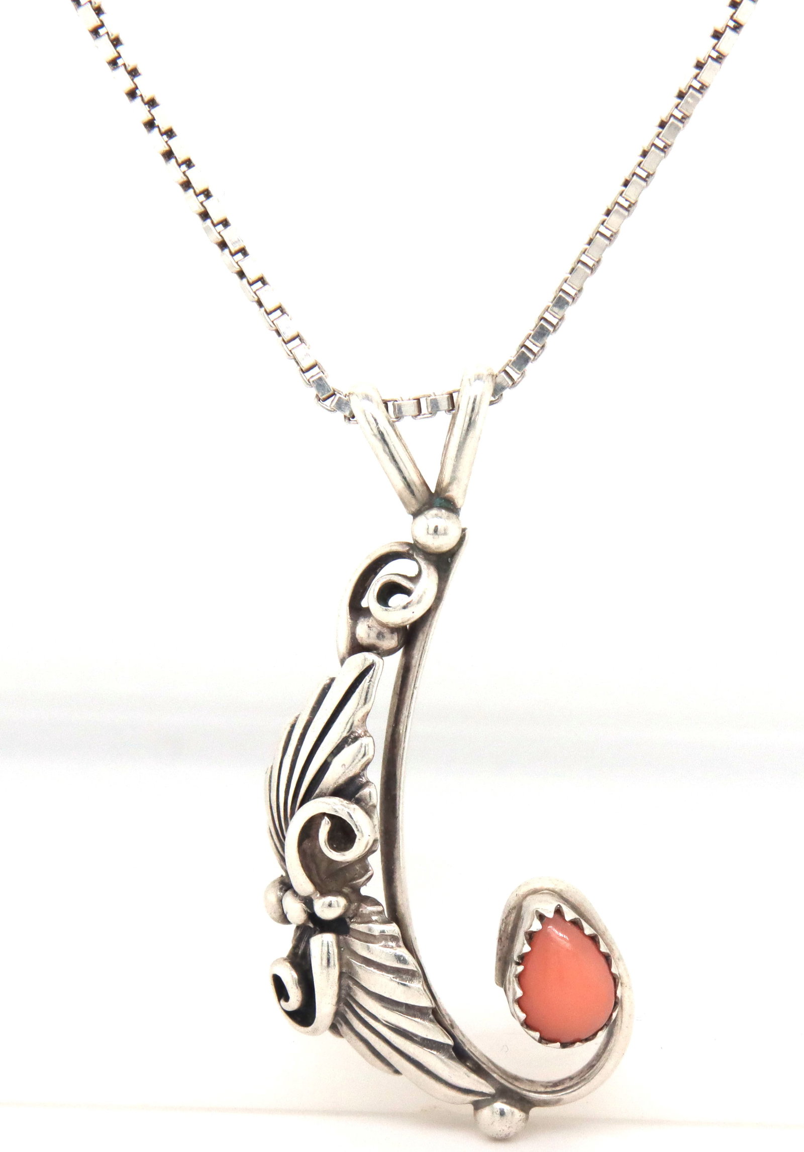 Vintage 925 sterling silver pendant on box chain necklace: Vintage 925 sterling silver pendant on 25-inch Italian box chain necklace. The total weight of the necklace is 10.2 grams.