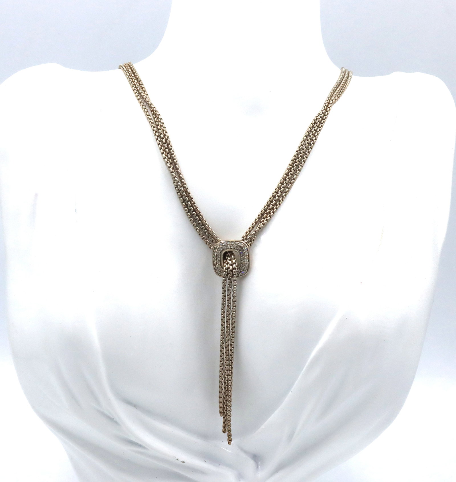 David Yurman waterfall lariat tassel with diamonds: 925 Sterling silver David Yurman 16-inch necklace waterfall lariat tassel with single pave diamonds embellished square. The total weight of the necklace is 21.2 grams.
