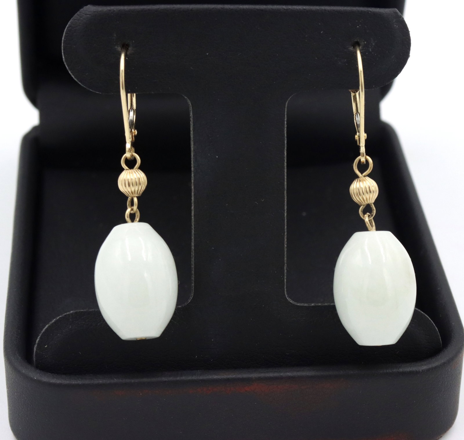 14kt Yellow gold Lavender Jade dangle earrings: 14kt Yellow gold Lavender Jade dangle earrings. The total weight of the earrings is 10.2 grams.