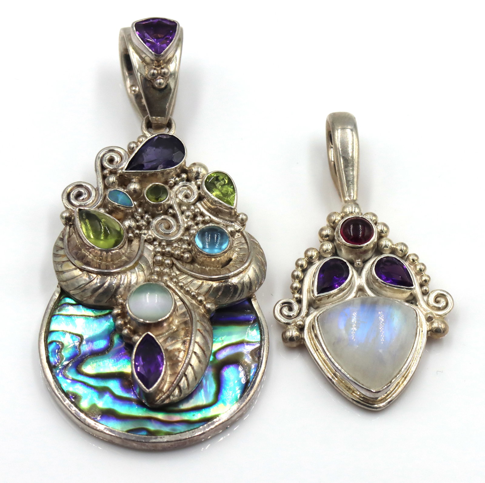 Lot of 2 925 sterling silver Sajen amethyst, abalone and blue topaz pendants: Lot of 2 925 sterling silver Sajen amethyst, abalone and blue topaz pendants. The total weight of the lot is 31.3 grams.